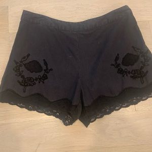 Black linen shorts with lace trim